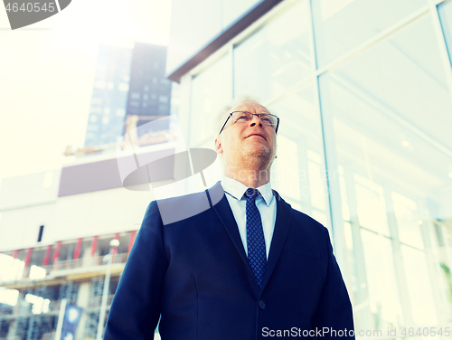 Image of senior businessman on city street