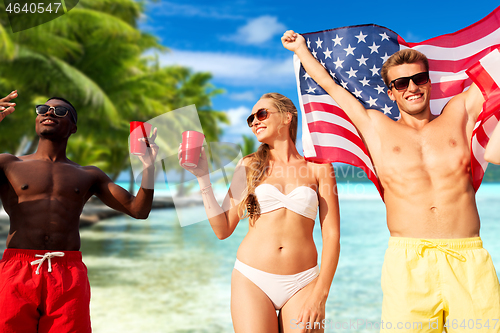 Image of friends at american independence day beach party