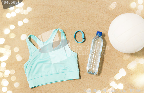 Image of sports top, ball, fitness tracker and water bottle