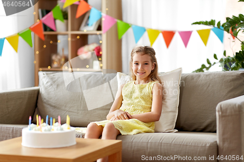 Image of happy birthday girl with cake at home party
