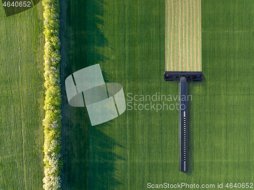 Image of Green field with disposable shaving machine.