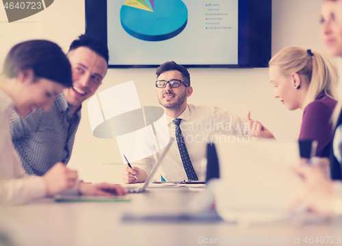 Image of young business people group on team meeting at modern office