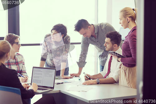 Image of young business people group on meeting at modern office