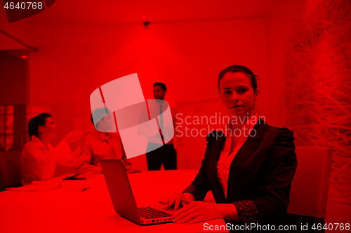 Image of young business woman on meeting  using laptop computer