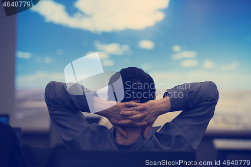 Image of young man dreaming clouds on presentation