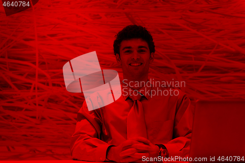 Image of young business man  working on laptop  computer at modern office