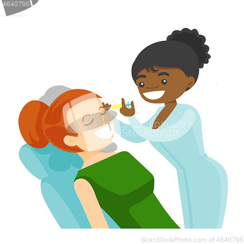 Image of Woman receiving beauty facial injection in salon.