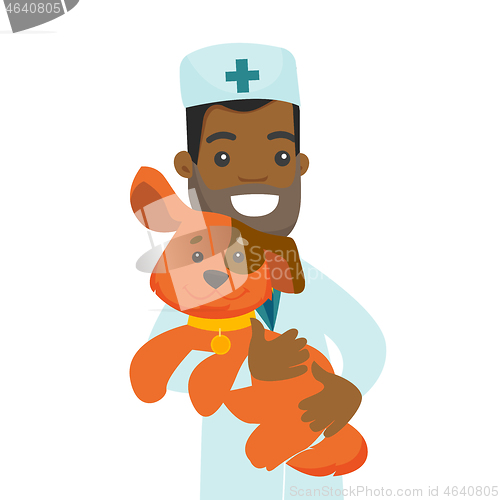 Image of African-american veterinarian with dog in hands.