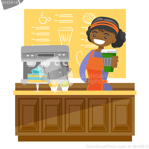 Image of Young african barista making a cup of coffee.