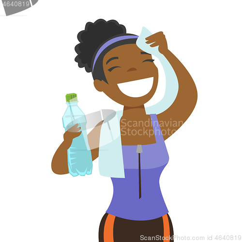 Image of African sportswoman wiping sweat with a towel.