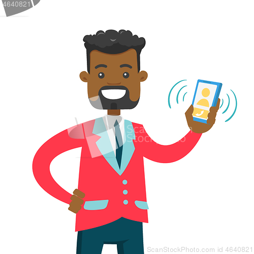 Image of Young african man holding ringing mobile phone.