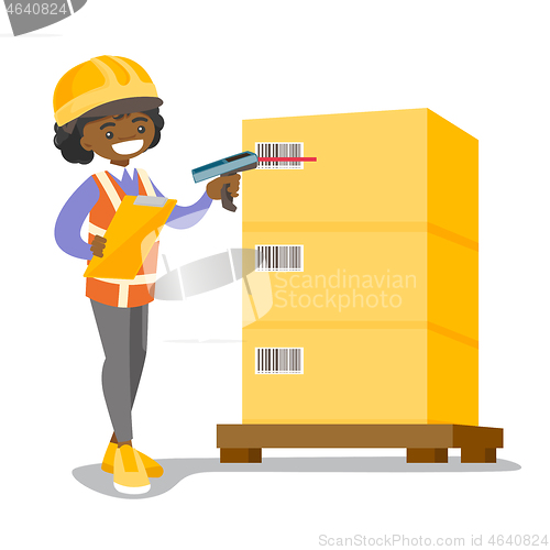 Image of African warehouse worker scanning barcode on box.