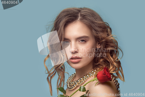 Image of Beautiful young girl in studio with pearl jewelry - earrings, bracelet, necklace.