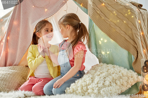 Image of little girls talking in kids tent at home