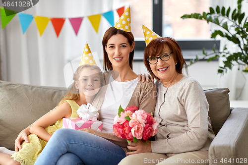Image of mother, daughter and grandmother at birthday party
