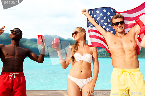 Image of friends at american independence day beach party