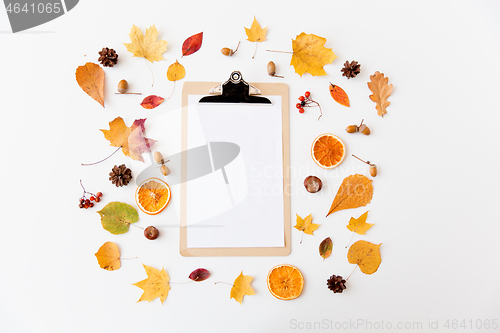 Image of autumn fruits and clipboard with blank white paper