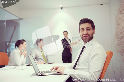 Image of young business man at meeting