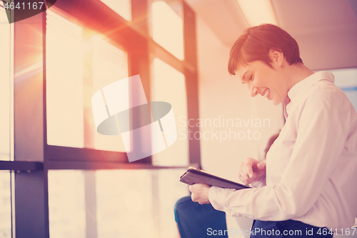 Image of business woman on meeting  using tablet computer