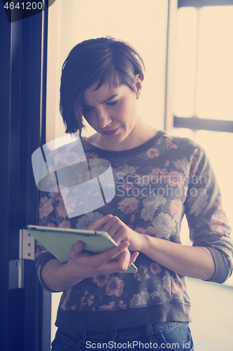 Image of business woman working on tablet