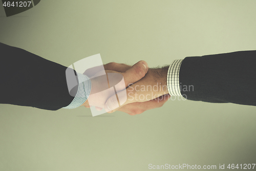 Image of cloasing the deal in modern office interior top view