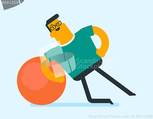 Image of Young caucasian white man exercising with fit ball