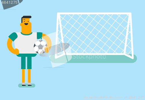 Image of Caucasian football player standing with a ball.