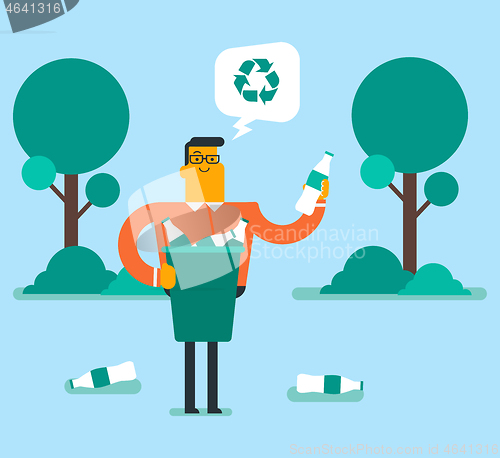 Image of Man picking up plastic bottle in a recycling bin.