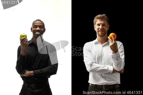 Image of Men eating a fruits on a black and white background