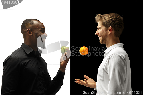 Image of Men eating a fruits on a black and white background