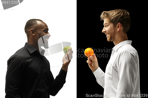 Image of Men eating a fruits on a black and white background