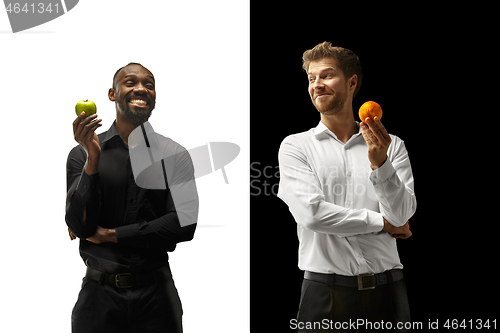 Image of Men eating a fruits on a black and white background