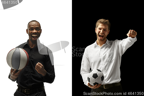 Image of Portrait of a smiling men holding soccer and basketball ball isolated on a white and black background