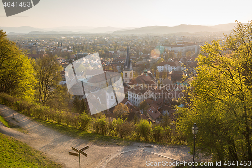 Image of Panoramic view of Ljubljana, capital of Slovenia. Roooftops of Ljubljanas old medieval city center seen from Ljubljanas castle park at sunset