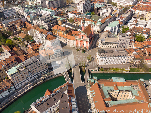 Image of Aerial drone view of Preseren Squere and Triple Bridge over Ljubljanica river,Tromostovje, Ljubljana, Slovenia. Empty streets during corona virus pandemic social distancing measures