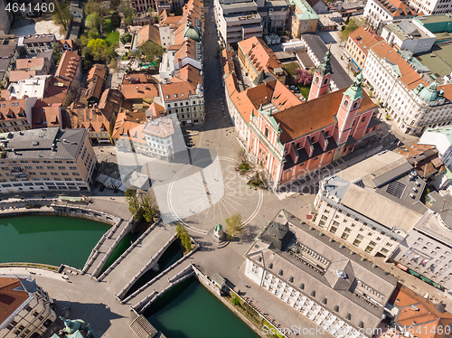 Image of Aerial drone view of Preseren Squere and Triple Bridge over Ljubljanica river,Tromostovje, Ljubljana, Slovenia. Empty streets during corona virus pandemic social distancing measures