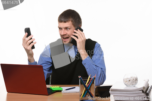 Image of exasperated boss on the phone gives orders