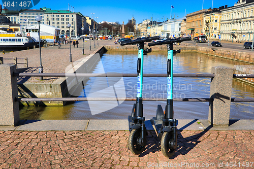 Image of Two Electric Scooters Parked in City