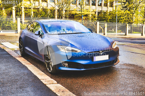 Image of Blue Tesla Model S on Rainy Morning