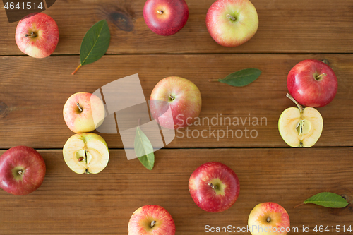 Image of ripe red apples on wooden table