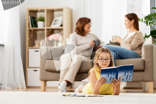 Image of student girl with textbook learning at home