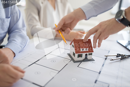 Image of close up of architects discussing house project