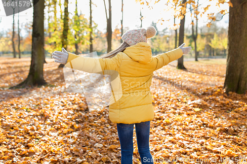 Image of happy girl at autumn park