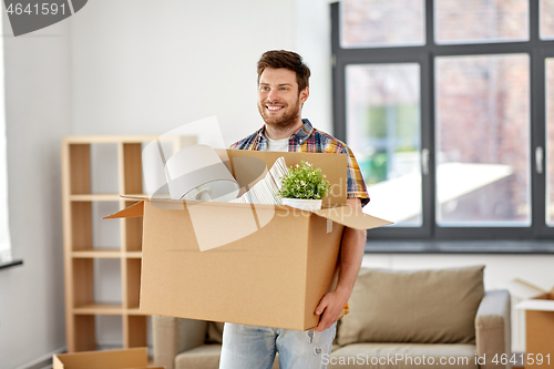 Image of happy man with box moving to new home