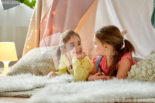 Image of little girls talking in kids tent at home