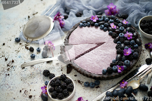 Image of Homemade piece of delicious blueberry, blackberry and grape pie 