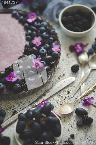 Image of Homemade blackberry tart. Sweet pie with blackberrym blueberry a