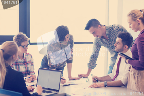 Image of young business people group on meeting at modern office