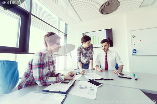 Image of young business people group on meeting at modern office