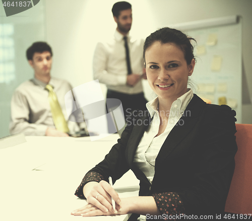 Image of young business woman on meeting  using laptop computer